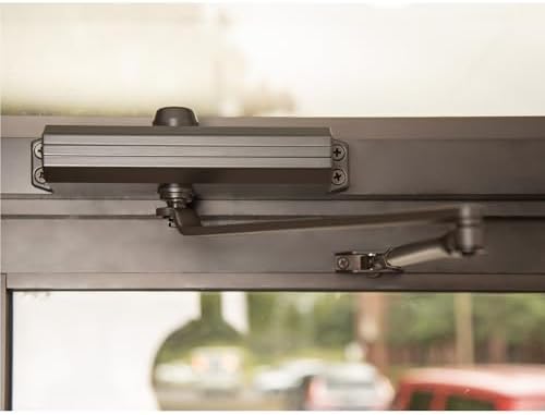 global door controls tc201-du compact commercial door closer shown in use