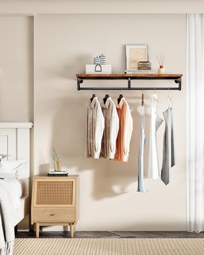 choezon wall mounted clothes rack, metal garment rack shown in use
