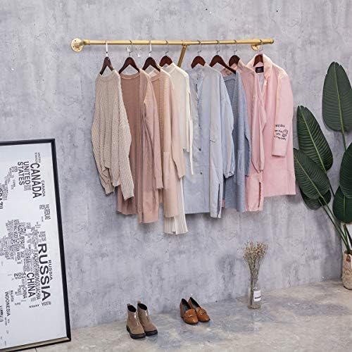 industrial pipe wall mounted clothes hanging shelves system,metal, close-up detail
