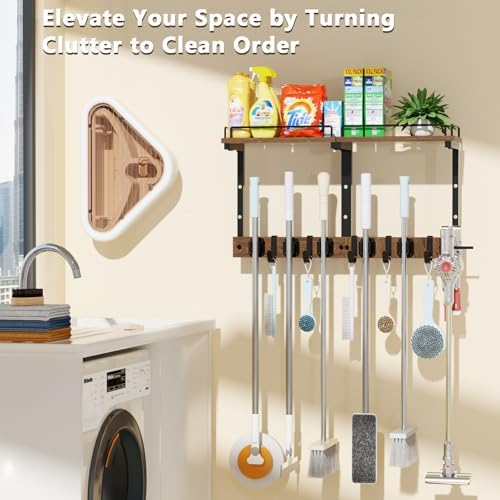 broom and mop organizer wall hanging with cleaning shown in use