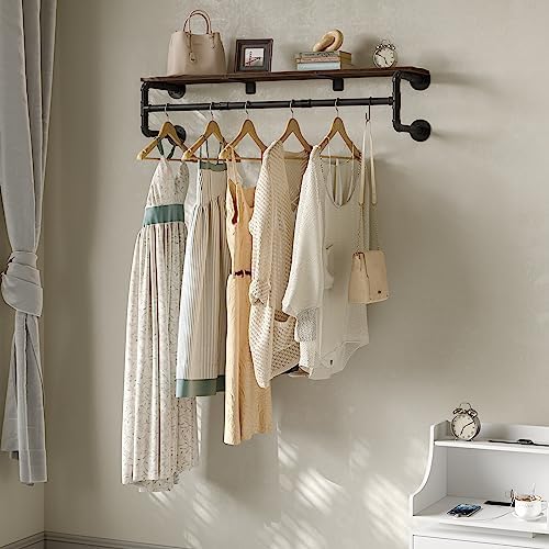 industrial pipe clothes rack with top shelf and shown in use