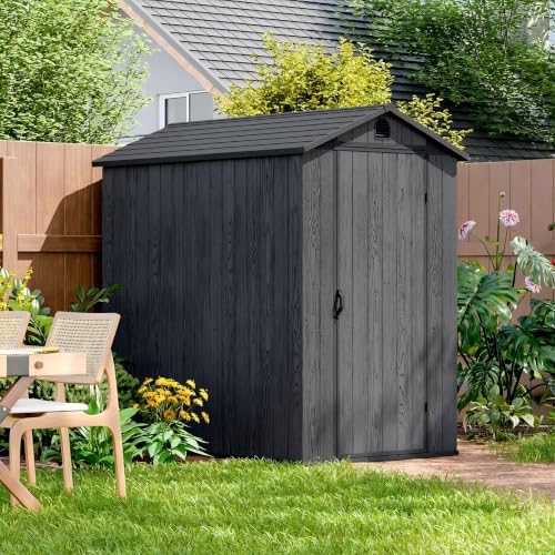 patiowell 4x6 ft resin storage shed with floor shown in use