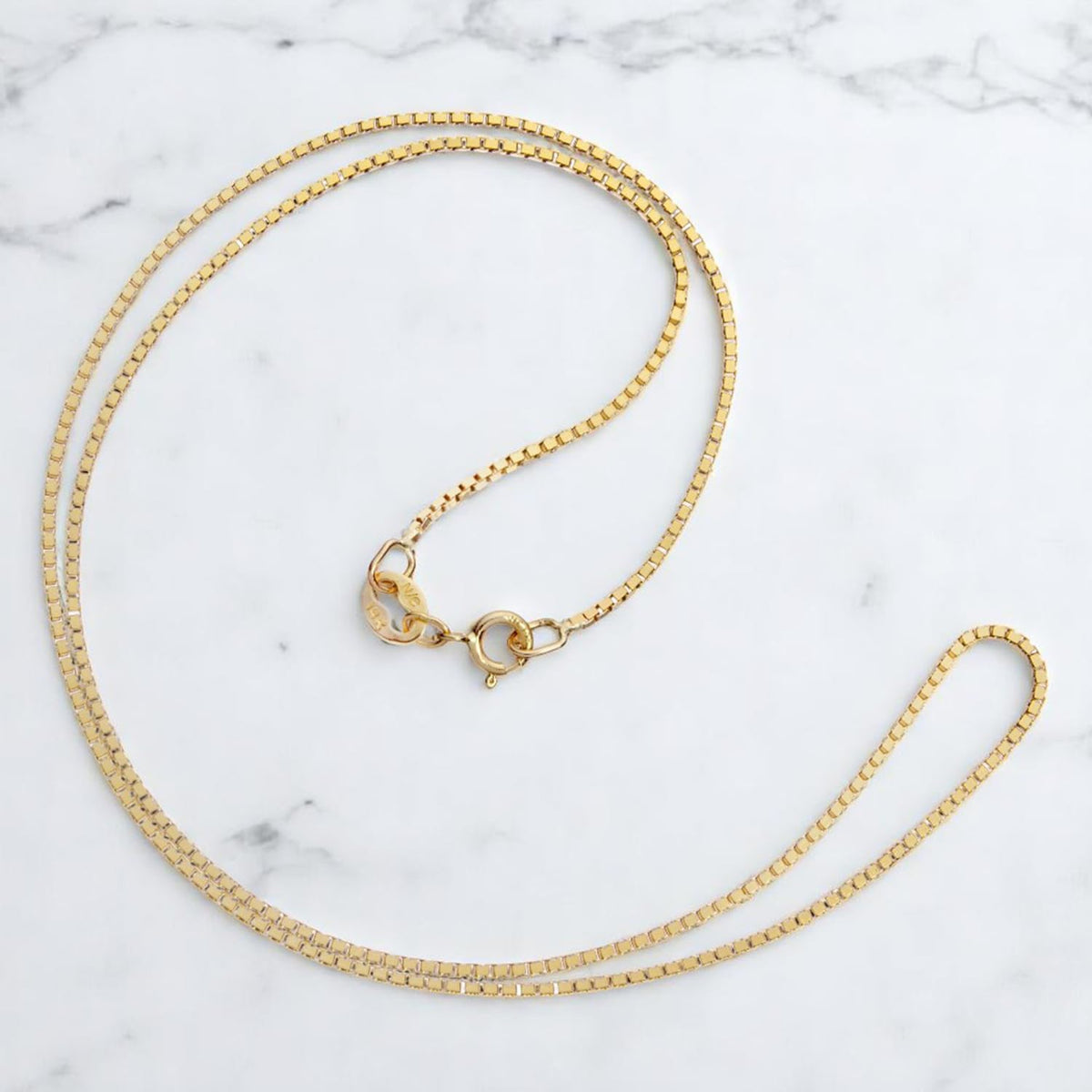 everyday elegance 10k gold box chain necklace for on a desk or shelf