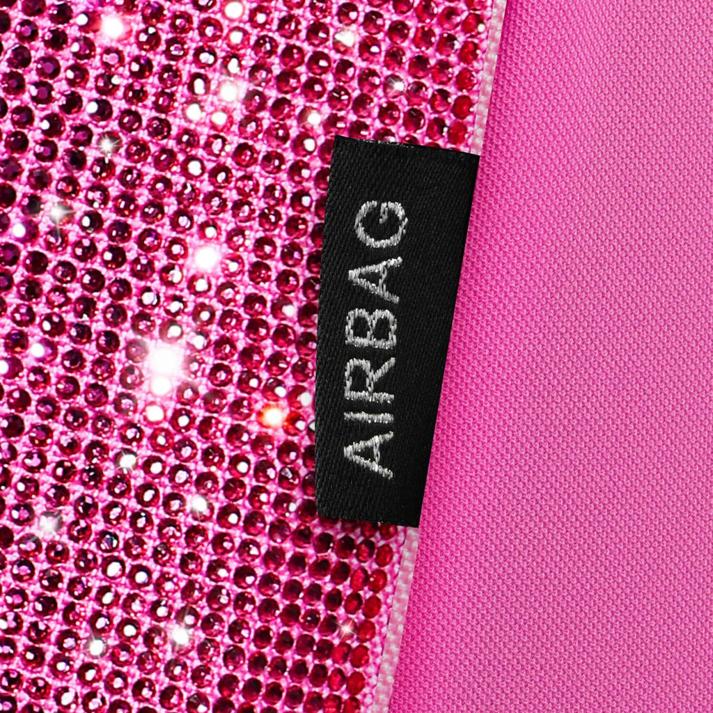 car pass hot pink bling diamond leather car, front angle view